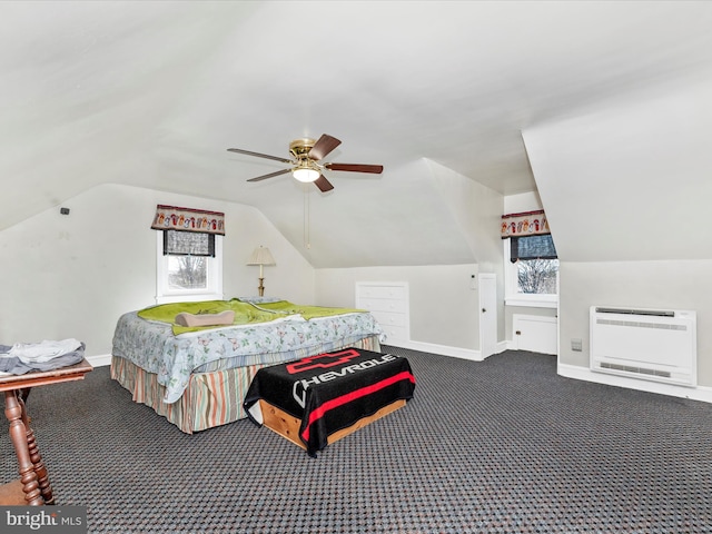 carpeted bedroom with baseboards, multiple windows, and heating unit