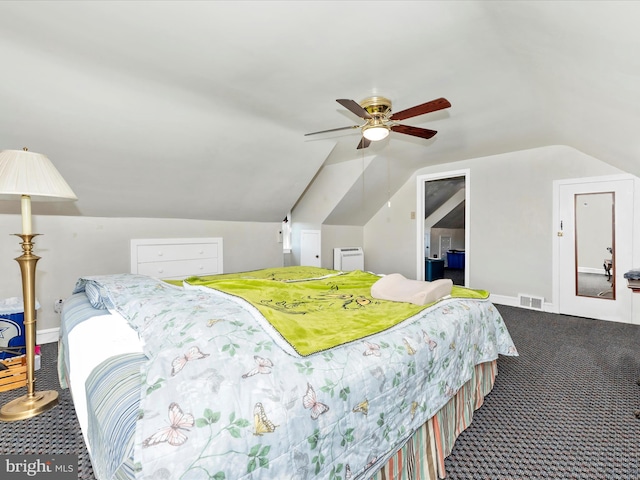 carpeted bedroom with vaulted ceiling, baseboards, visible vents, and a ceiling fan