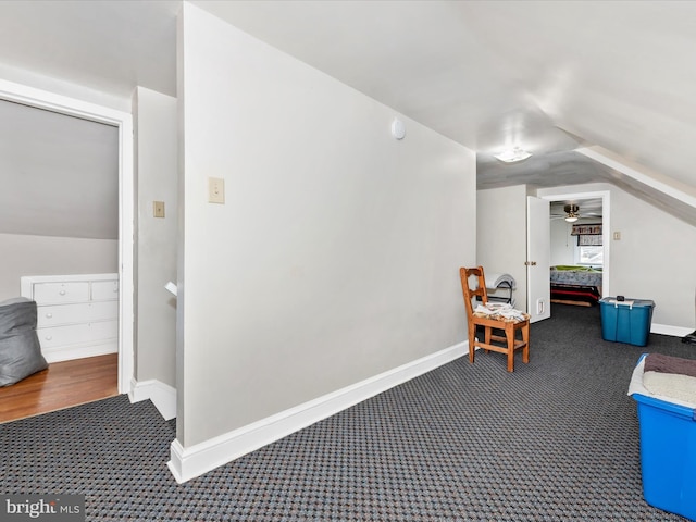 bonus room featuring carpet flooring, vaulted ceiling, and baseboards