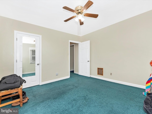 interior space featuring carpet floors, visible vents, connected bathroom, ceiling fan, and baseboards