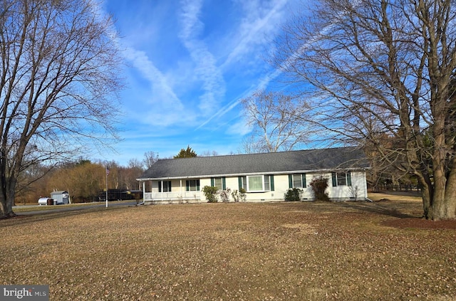 single story home featuring a front yard