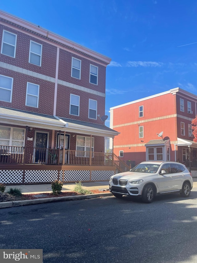 view of property featuring brick siding