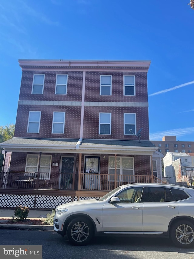 view of property with brick siding