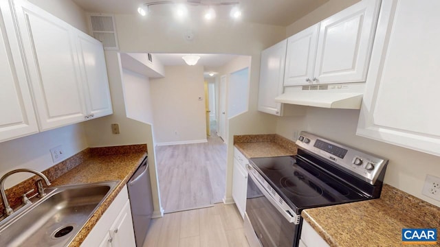 kitchen with visible vents, appliances with stainless steel finishes, white cabinets, a sink, and under cabinet range hood