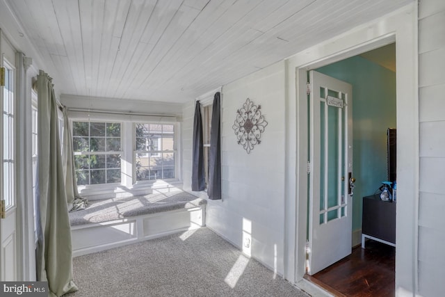 sunroom / solarium featuring wooden ceiling