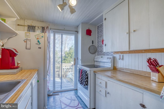 laundry room featuring wooden ceiling and a sink