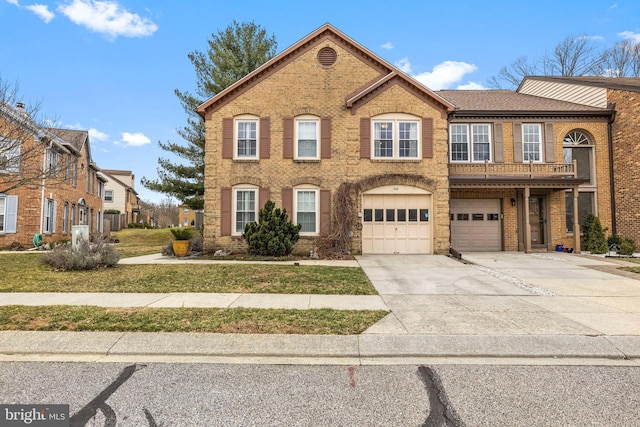 view of front of house featuring driveway, a garage, and brick siding