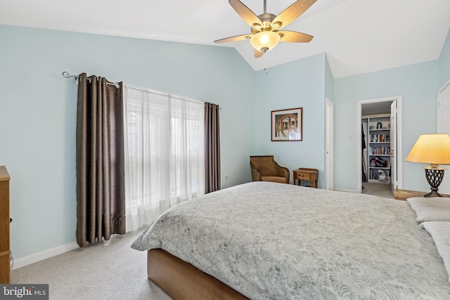 bedroom with light carpet, baseboards, lofted ceiling, ceiling fan, and a closet