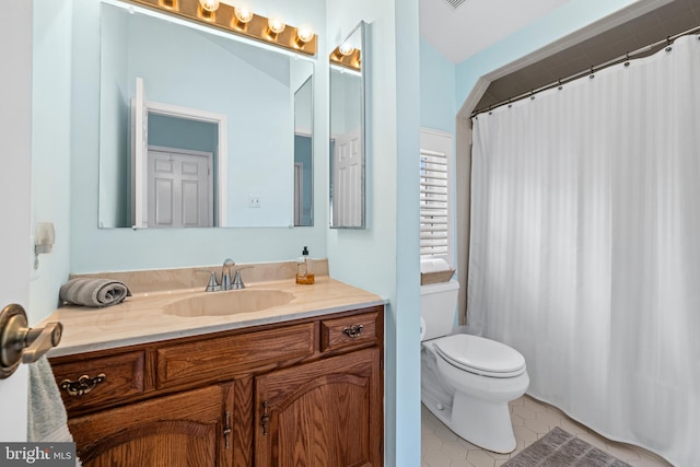 full bathroom with tile patterned flooring, vanity, toilet, and a shower with curtain