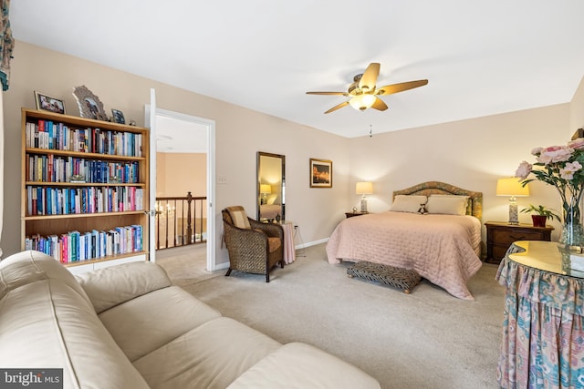 bedroom featuring carpet floors, baseboards, and a ceiling fan