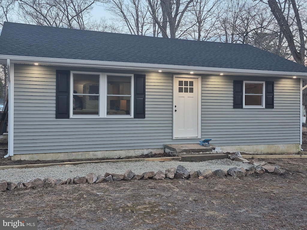 view of front of house featuring a shingled roof