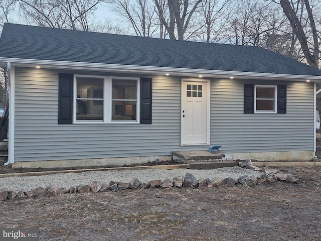 view of front of house featuring a shingled roof