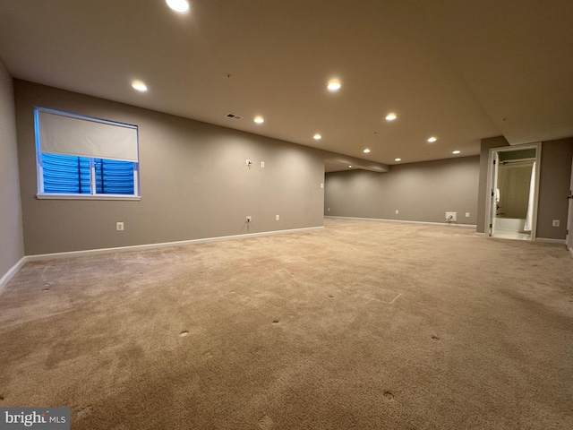 basement featuring carpet floors, recessed lighting, visible vents, and baseboards