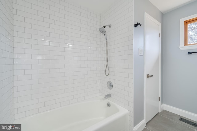 full bath featuring shower / bath combination, baseboards, visible vents, and tile patterned floors