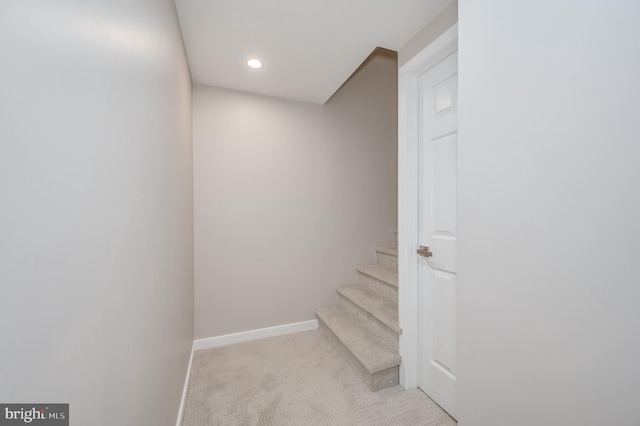 stairs with carpet, baseboards, and recessed lighting