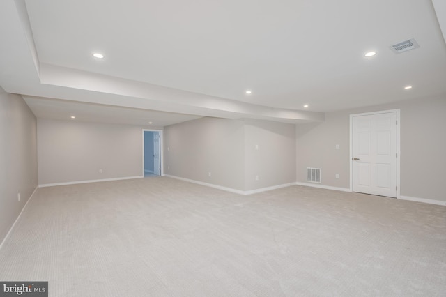 finished basement with recessed lighting, visible vents, baseboards, and light colored carpet