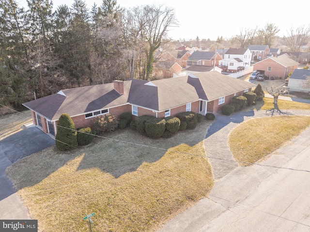 birds eye view of property with a residential view