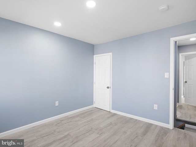 unfurnished bedroom featuring recessed lighting, baseboards, and wood finished floors