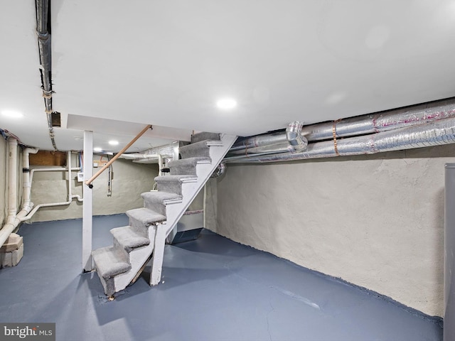 unfinished basement with stairs