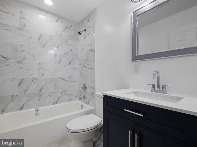 bathroom featuring toilet, washtub / shower combination, and vanity