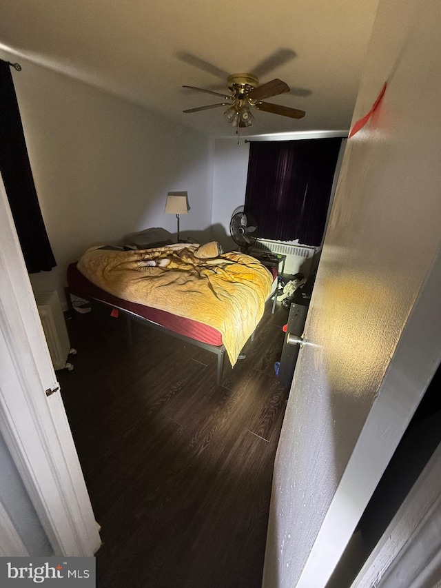 bedroom featuring ceiling fan and wood finished floors