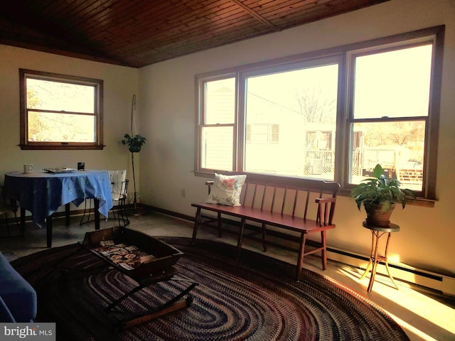 sitting room featuring wood ceiling and baseboards