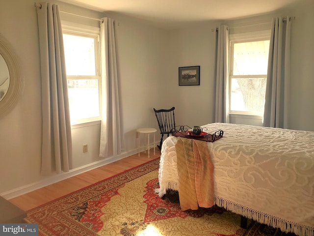 bedroom with light wood-type flooring