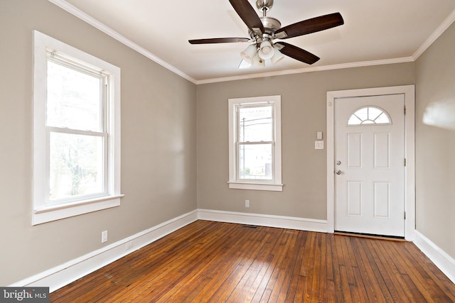 entryway featuring ornamental molding, hardwood / wood-style floors, a ceiling fan, and baseboards