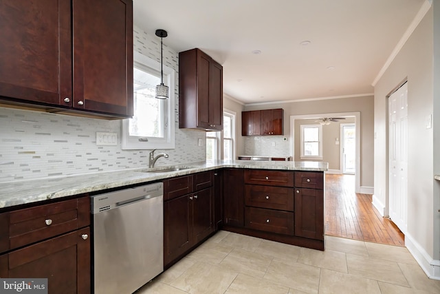 kitchen with a peninsula, a sink, stainless steel dishwasher, tasteful backsplash, and crown molding