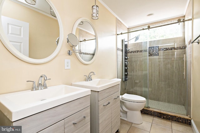 bathroom with a stall shower, crown molding, a sink, and tile patterned floors