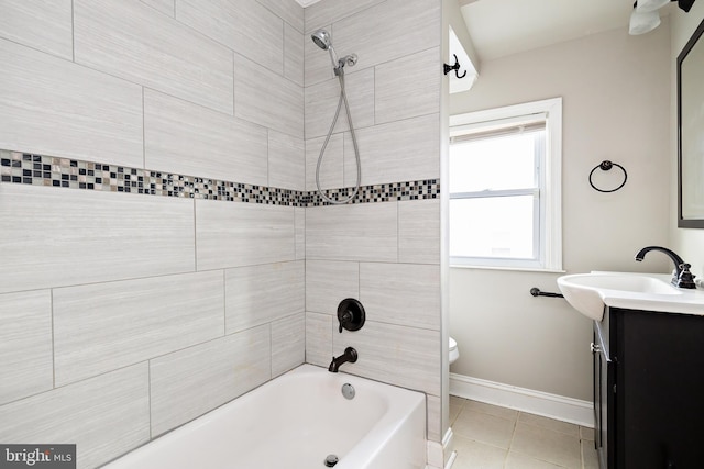 bathroom with toilet, vanity, baseboards, shower / washtub combination, and tile patterned floors