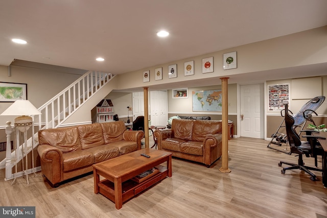 living area with stairway, light wood-style flooring, and recessed lighting