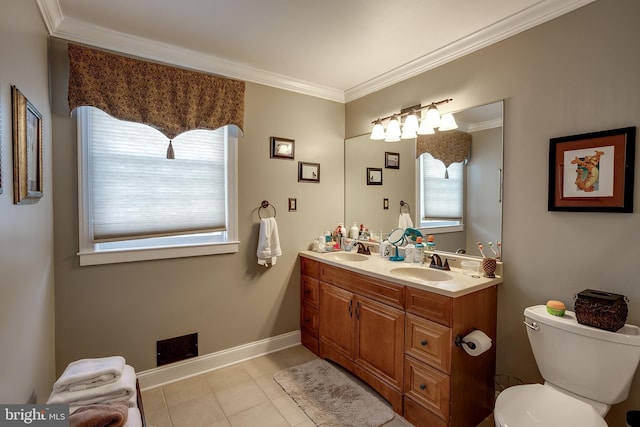 full bathroom featuring toilet, tile patterned flooring, crown molding, and a sink