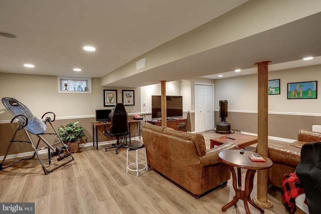 living area with light wood finished floors, baseboards, and recessed lighting