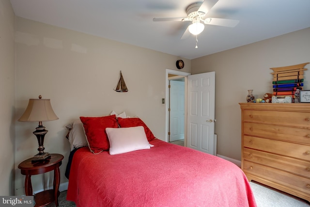 bedroom featuring ceiling fan and baseboards