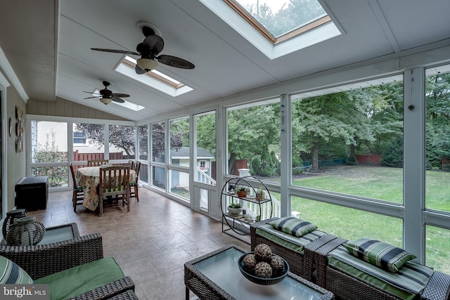 sunroom / solarium with vaulted ceiling with skylight and ceiling fan