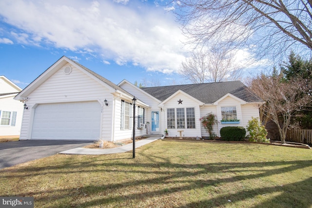 ranch-style home featuring a garage, roof with shingles, a front lawn, and aphalt driveway