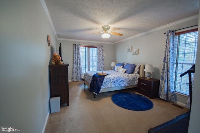 bedroom with visible vents, ceiling fan, a textured ceiling, crown molding, and carpet floors