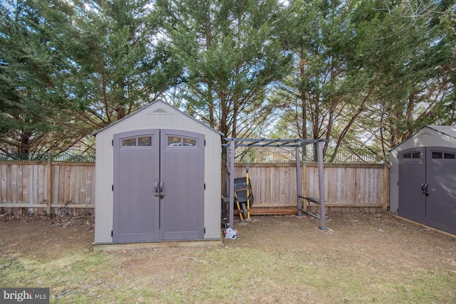 view of shed with a fenced backyard