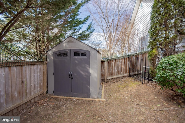 view of shed with a fenced backyard