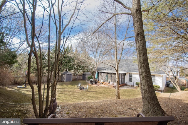 view of front of property featuring a storage unit and an outbuilding