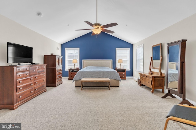 bedroom featuring a ceiling fan, lofted ceiling, light colored carpet, and baseboards