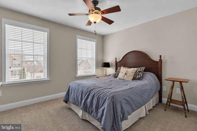 bedroom with carpet floors, baseboards, and a ceiling fan