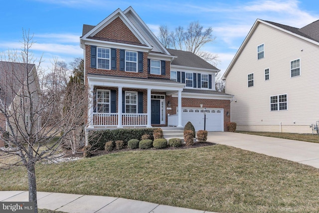 traditional home with driveway, covered porch, a front lawn, and brick siding