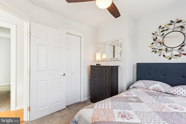 bedroom featuring a closet, ceiling fan, baseboards, and carpet floors