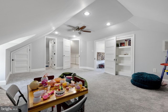 interior space featuring baseboards, vaulted ceiling, light carpet, recessed lighting, and a ceiling fan