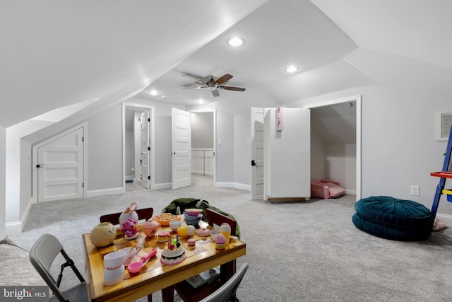 interior space with light carpet, lofted ceiling, a ceiling fan, recessed lighting, and baseboards