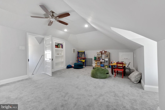 recreation room featuring built in shelves, baseboards, carpet, lofted ceiling, and recessed lighting