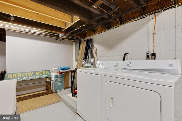 laundry room with separate washer and dryer and laundry area