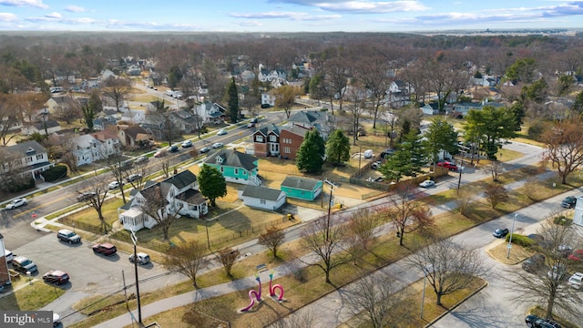 birds eye view of property with a residential view